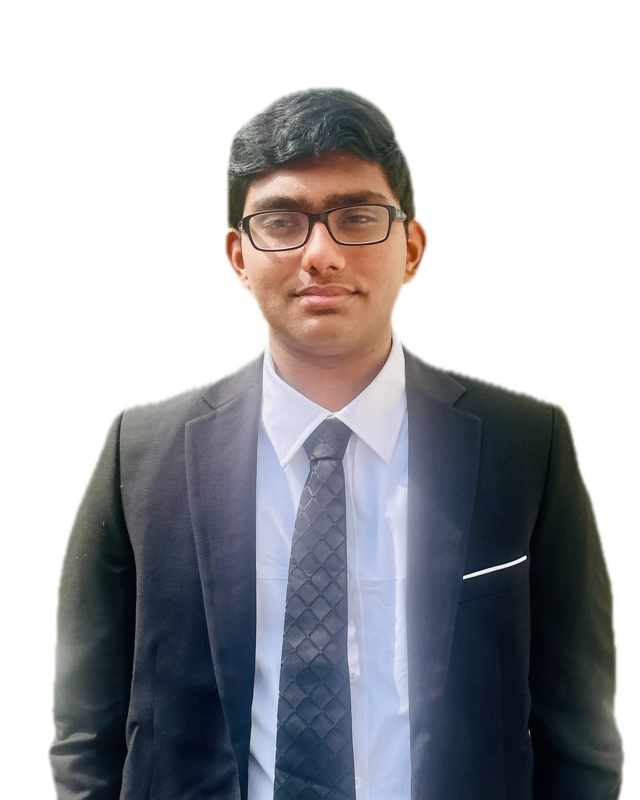 Portrait of Charan Pyloore in a dark suit and tie